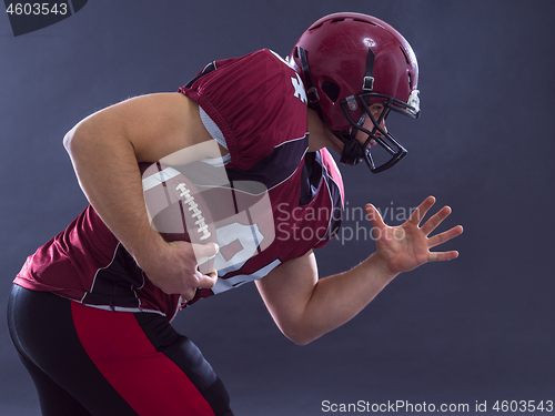 Image of American football Player running with the ball