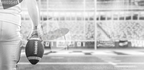 Image of closeup American Football Player isolated on big modern stadium