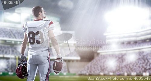 Image of American Football Player isolated on big modern stadium field