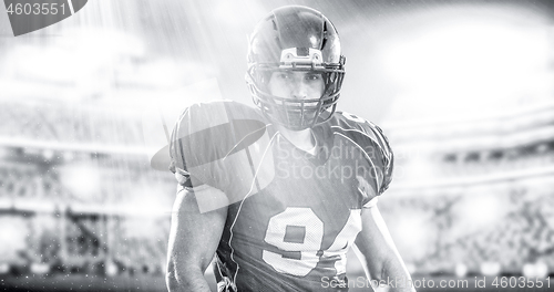 Image of American Football Player isolated on big modern stadium field