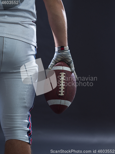 Image of closeup American Football Player isolated on gray