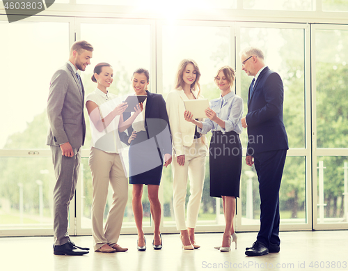 Image of business people with tablet pc computers at office