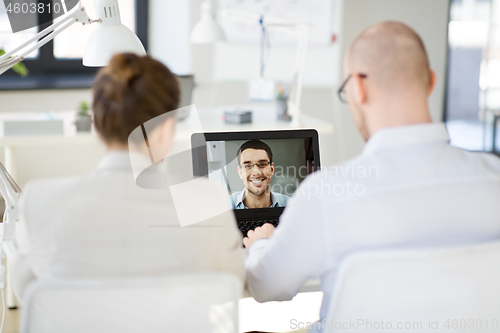 Image of business team having video conference at office