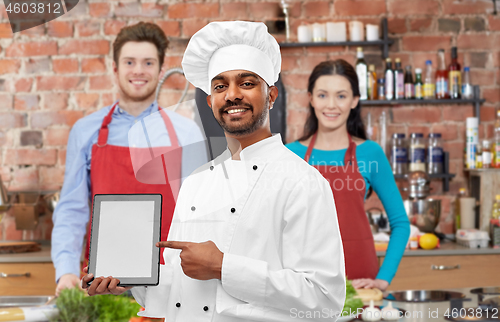 Image of indian chef with tablet computer at cooking class