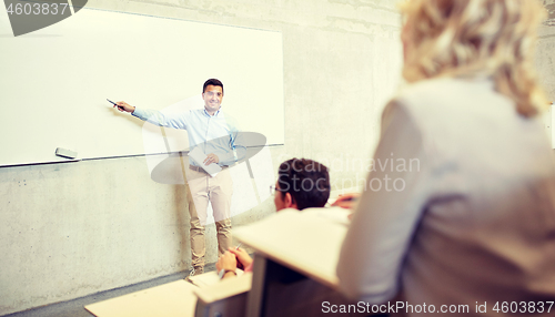 Image of group of students and teacher at lecture