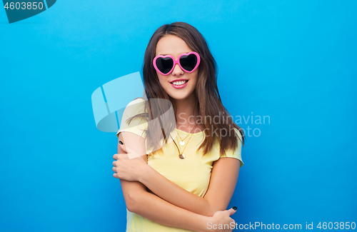 Image of teenage girl in heart-shaped sunglasses