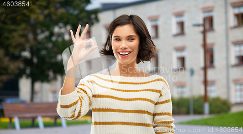 Image of happy smiling woman or student girl showing ok