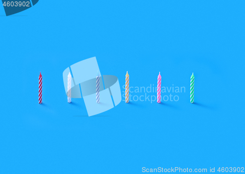 Image of Greeting set from vertically standing birthday candles for cake.