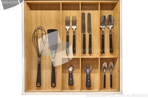 Image of Minimalist kitchen tools put away in a drawer