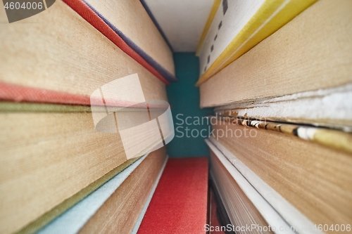 Image of Piled up books macro view between them