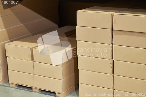 Image of Warehouse stocked with boxes in stacks