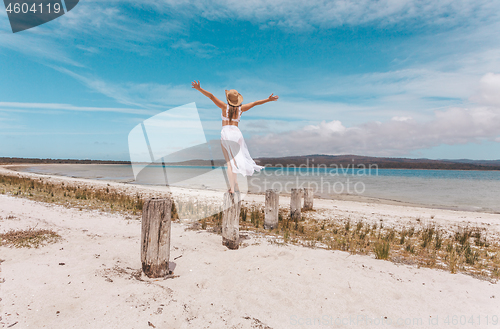 Image of Female joy freedom live life to the full travel beach concept