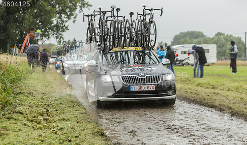 Image of Row of Technical Cars on a Cobblestone Road - Tour de France 201