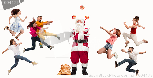 Image of Happy running Christmas people over white background