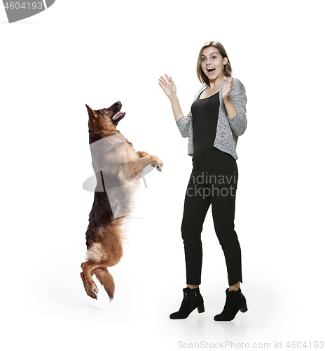 Image of Woman with her dog over white background