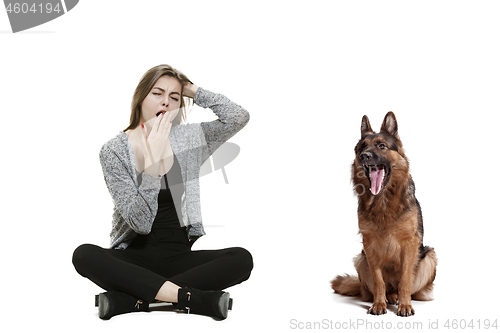 Image of Woman with her dog over white background