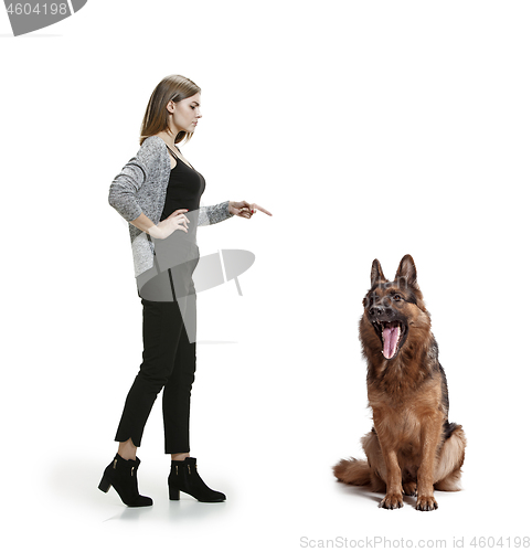 Image of Woman with her dog over white background