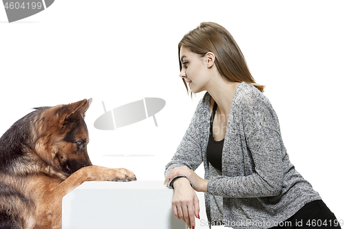 Image of Woman with her dog over white background