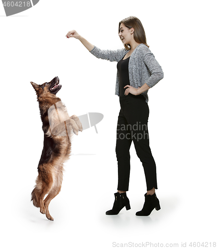 Image of Woman with her dog over white background