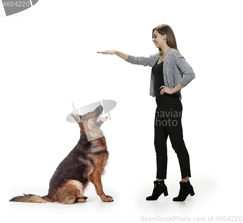 Image of Woman with her dog over white background