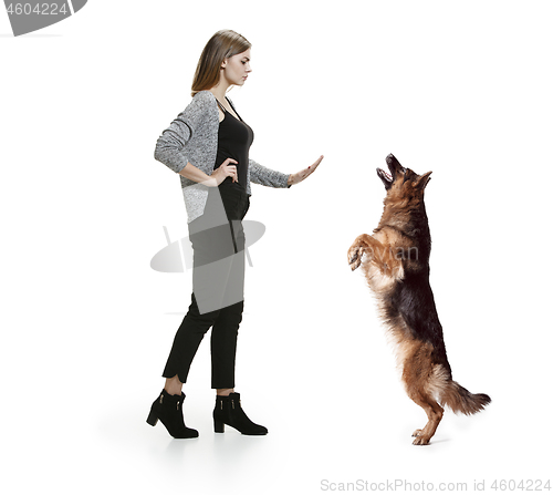 Image of Woman with her dog over white background