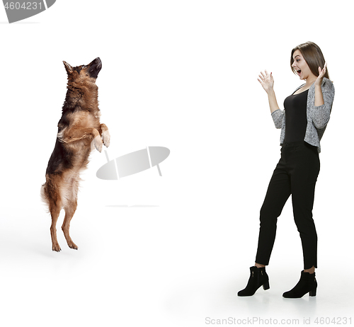 Image of Woman with her dog over white background