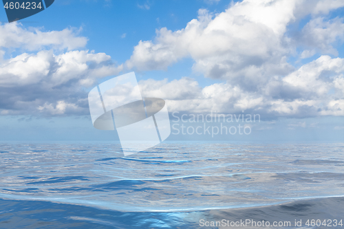 Image of blue sky with white clouds over the sea