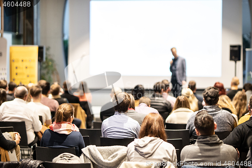 Image of Business speaker giving a talk at business conference event.