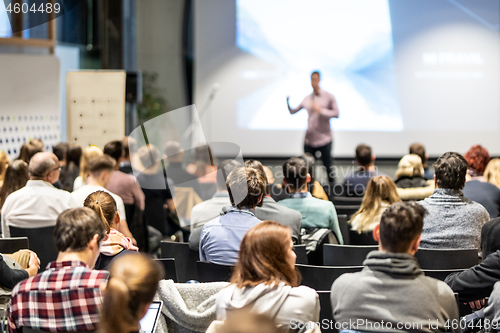 Image of Business speaker giving a talk at business conference event.