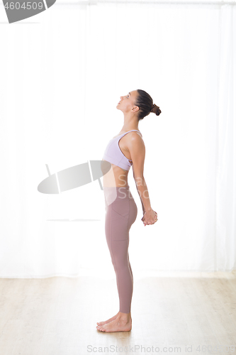 Image of Portrait of gorgeous active sporty young woman practicing breathing exercises in yoga studio. Healthy active lifestyle, working out indoors in gym