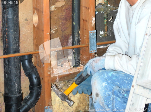 Image of Water pipe repairman.