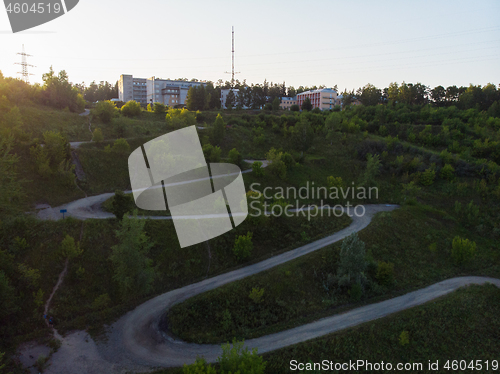 Image of Aerial top vew of winding road in the city