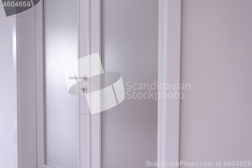 Image of double glass door with white wooden frame