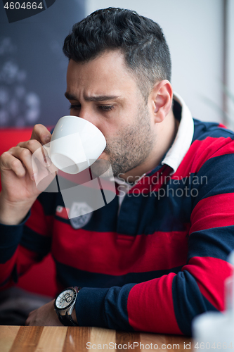 Image of business man drinking coffe