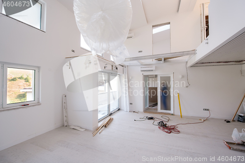 Image of carpenters installing glass door with a wooden frame