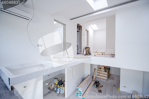 Image of Worker Installing New Laminated Wooden Floor