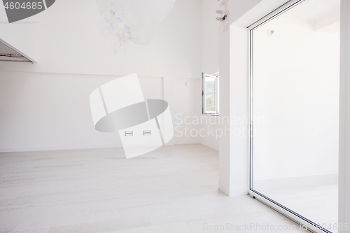 Image of Interior of empty stylish modern open space two level apartment