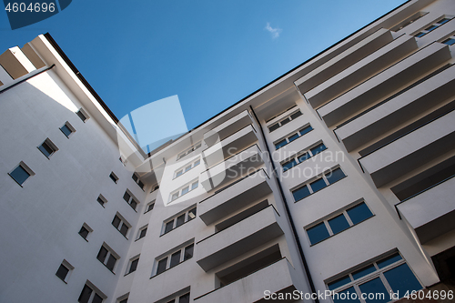 Image of Modern apartment buildings on a sunny day with a blue sky