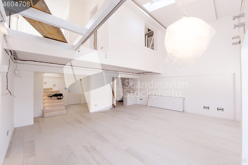 Image of Interior of empty stylish modern open space two level apartment