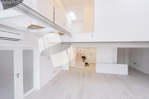 Image of Interior of empty stylish modern open space two level apartment