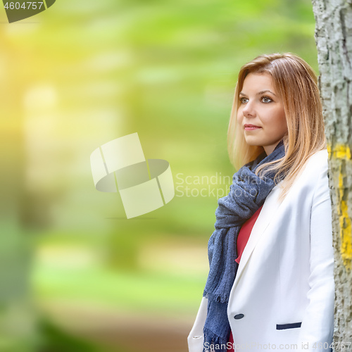 Image of beautiful young woman portrait autumn outdoor