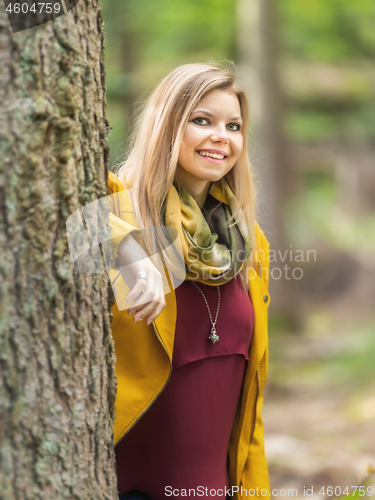 Image of beautiful young woman portrait autumn outdoor