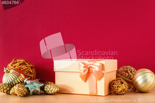 Image of Christmas gift box on red background