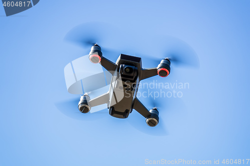 Image of toy drone blue sky background 