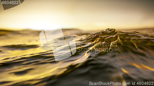 Image of golden sunset ocean wave background