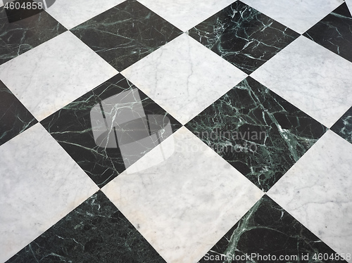 Image of chequered white green and black stone floor background