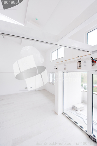 Image of Interior of empty stylish modern open space two level apartment