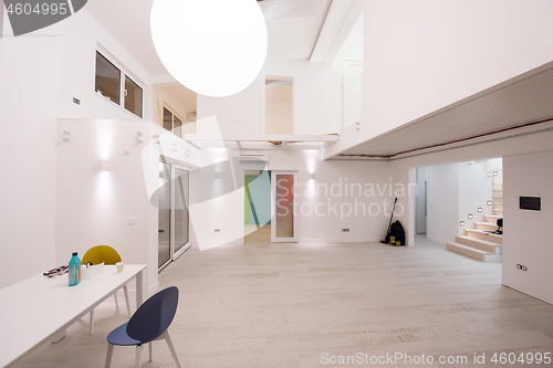 Image of Interior of empty stylish modern open space two level apartment