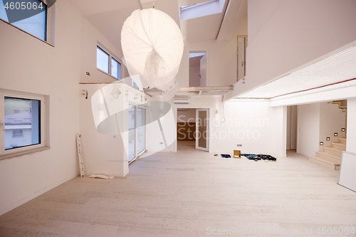 Image of Interior of empty stylish modern open space two level apartment