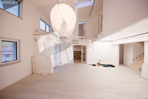 Image of Interior of empty stylish modern open space two level apartment